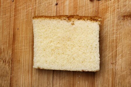 Butter cake on wood backgroundの写真素材