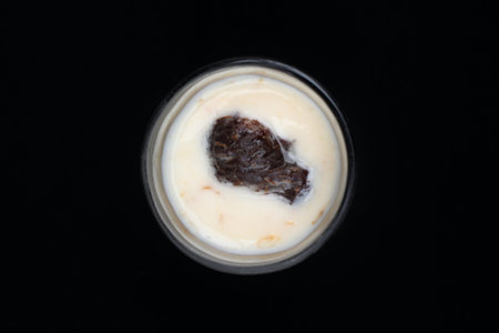 close up of yogurt and prunes