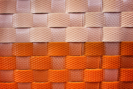 textured surface of  orange nylon strings