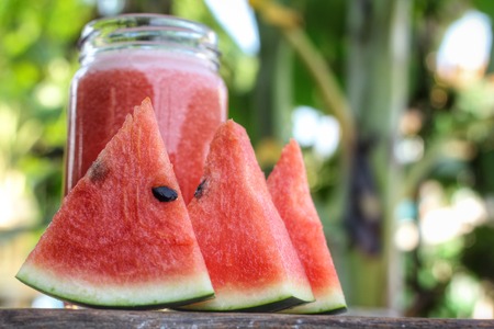 watermelon smoothies on the wood backgroundの写真素材