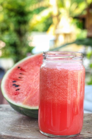 watermelon smoothies on the wood backgroundの写真素材