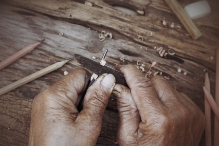 pencil sharpener on wood background -  vintage style.の写真素材