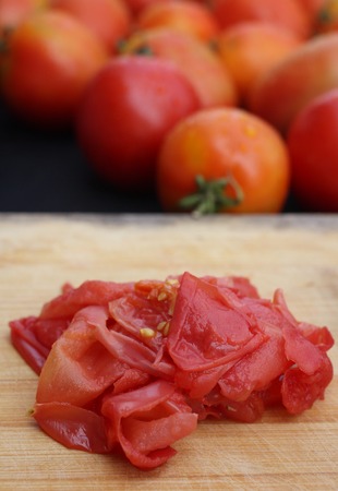 Tomato peeling for the sauceの写真素材