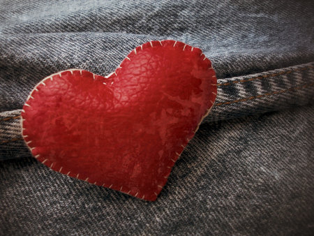 red heart on vintage jeansの写真素材