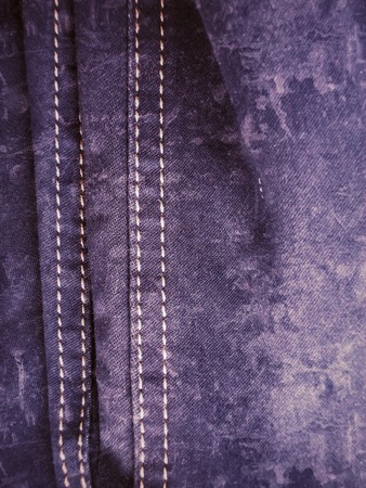 vintage jeans with seams background textureの写真素材