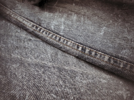vintage jeans with seams background textureの写真素材