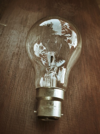 Light bulb on wood backgroundの写真素材