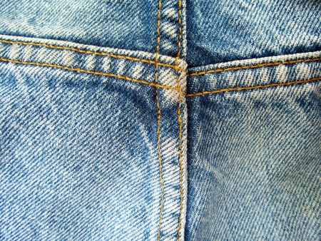vintage jeans with seams background textureの写真素材