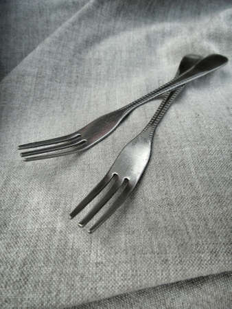 Silver fork on gray backgroundの写真素材