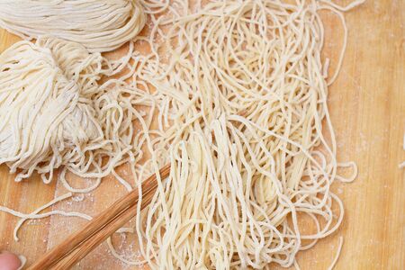 egg noodles and chopsticksの写真素材