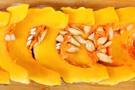 Slices of fresh pumpkins - ripe cut pumpkinsの写真素材