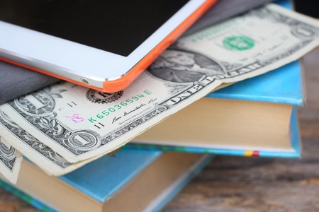 Tablet computer ,dolla and old bookの写真素材