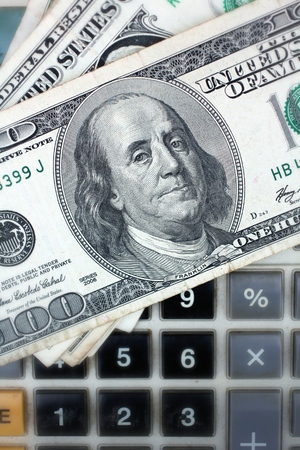 Calculator with dollar on black backgroundの写真素材