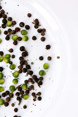 Black and green peppercornsの写真素材