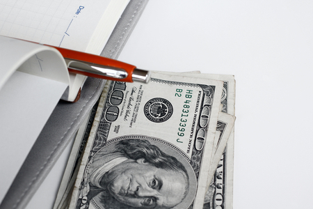 American dollars money with book and penの写真素材