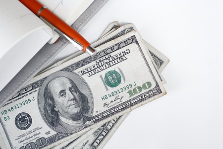 American dollars money with book and penの写真素材