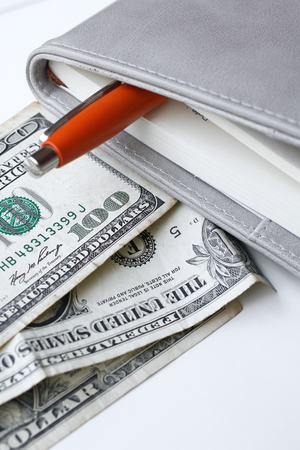 American dollars money with book and penの写真素材