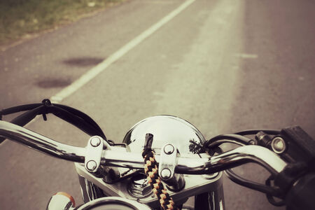 Driver riding motorcycle on the roadの写真素材