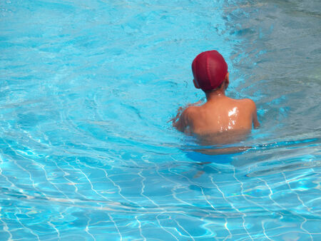 Children playing in the poolの写真素材