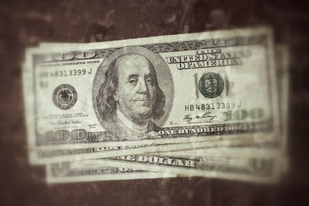 Many dollars banknotes - 100 dollar bills