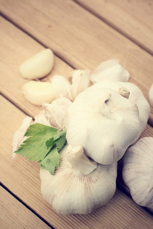 garlic on wooden table の写真素材
