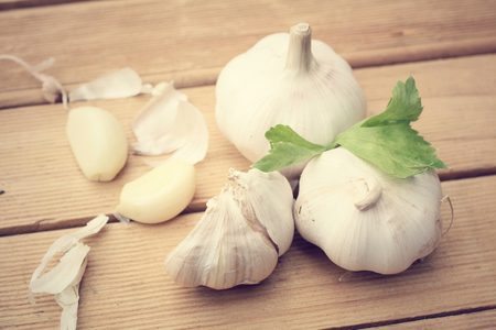 garlic on wooden tableの写真素材