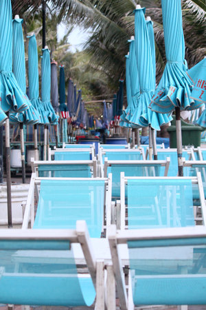 Beach chairs and umbrella の写真素材