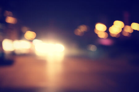 blurred of car in city at nightの写真素材