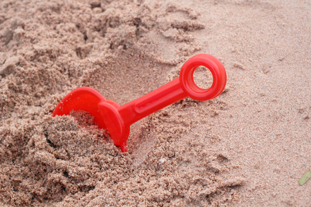 Children's beach toys on sandの写真素材