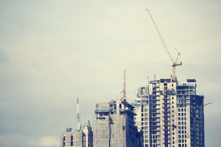Cranes and unfinished buildings