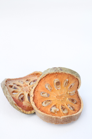 Slices of dried bael fruitの写真素材