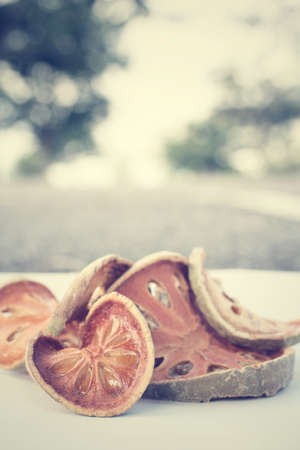 Slices of dried bael fruitの写真素材