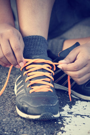 Tying sports shoes