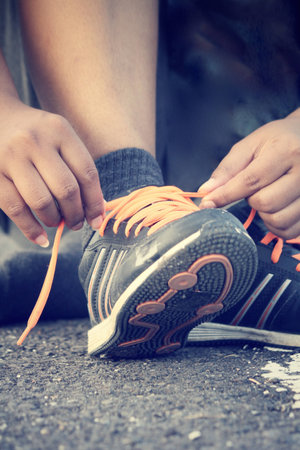 Tying sports shoes