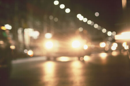 Blurred of car in city at nightの写真素材