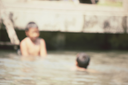 Blurred of children playing at damnoen saduak floating market, Thailandの写真素材