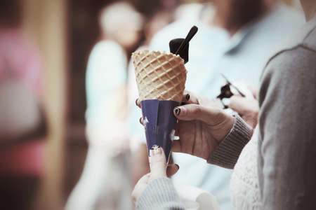 Eating ice cream coneの写真素材