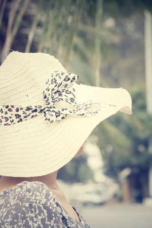 Happy woman with hat on summerの写真素材