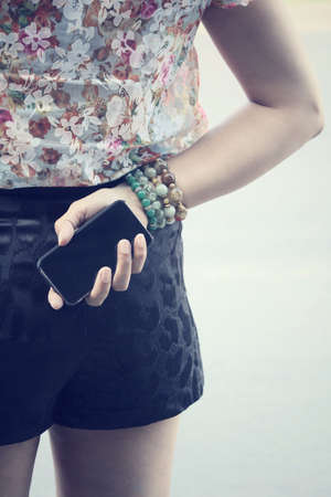 Woman with smart phoneの写真素材