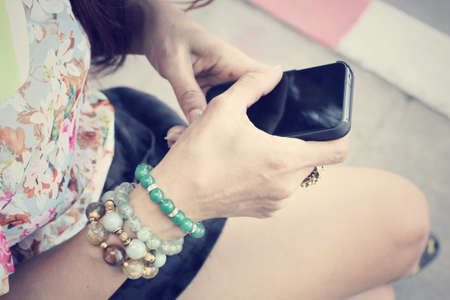 Woman using smart phoneの写真素材