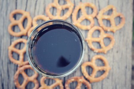 Cookies pretzels with hot coffeeの写真素材