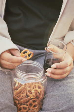 Cookies pretzels with hot coffeeの写真素材