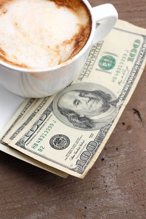 Hot coffee with dollarsの写真素材
