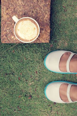 Hot coffee and shoesの写真素材