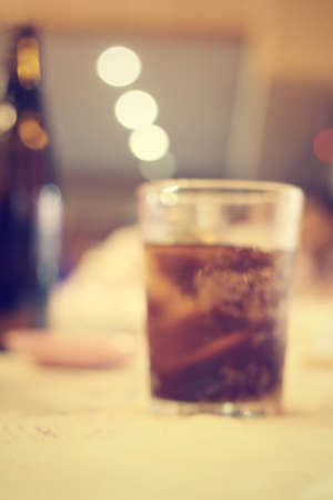 Blurred of cola with ice cubesの写真素材
