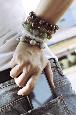 Smart phone in jeans pocketの写真素材