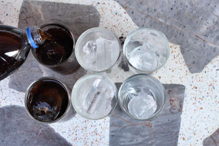 Cola with ice cubesの写真素材
