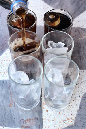 Cola with ice cubesの写真素材