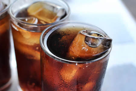 Cola with ice cubesの写真素材