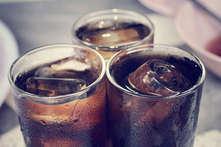 Cola with ice cubesの写真素材